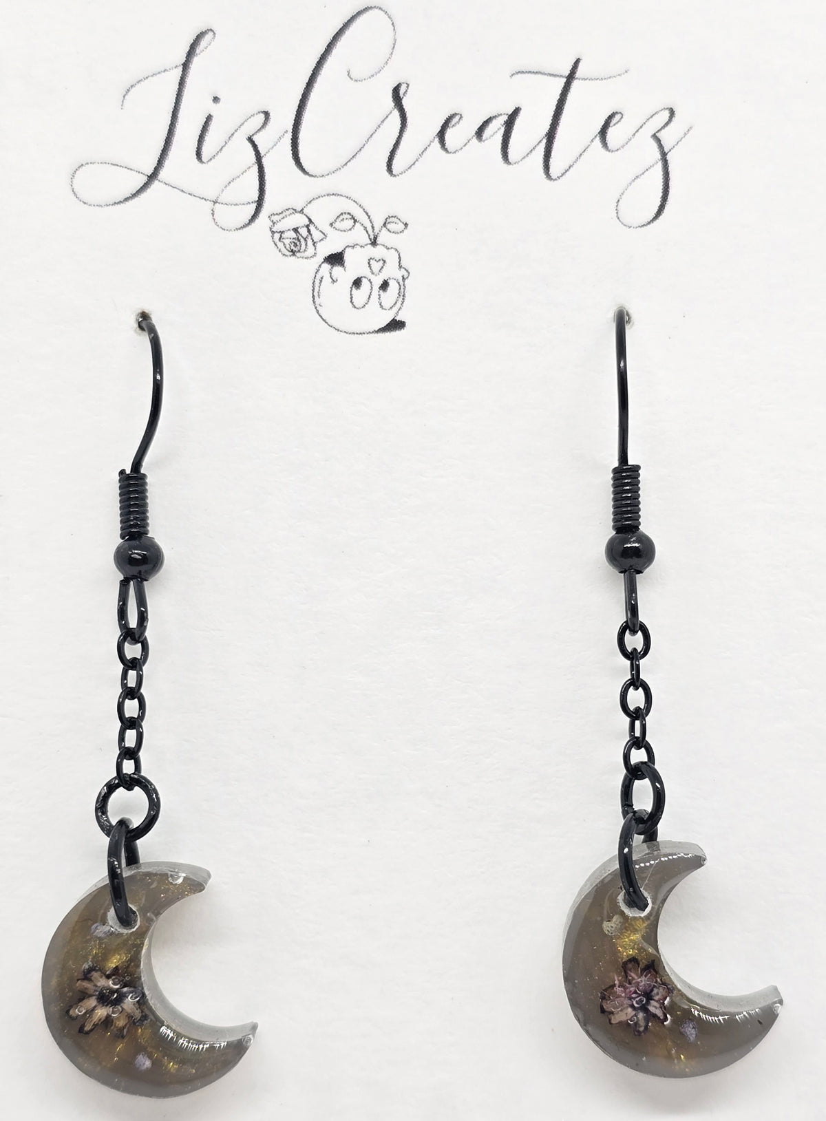 Dark mini moon-shaped earrings on sleek black hypoallergenic hooks