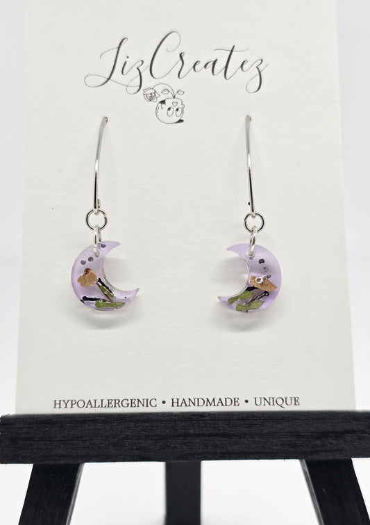 Mini moon-shaped V-hook earrings with a miniature mushroom preserved in clear resin