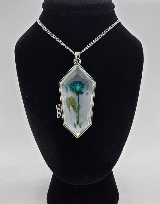 Coffin-shaped glass locket necklace with a real preserved blue rose inside, on an 18-inch silver chain